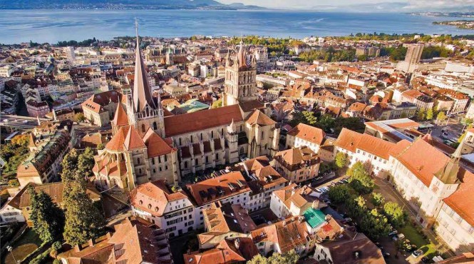 A view of the old town and cathedral, backed by Lake Geneva.