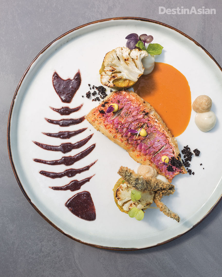 Red mullet with cauliflower couscous, pine nuts, and raisins at Hurawalhi Island's 5.8 restaurant, helmed by chef Bjoern van den Oever. 