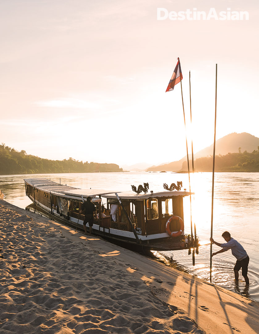 The Dok Keow moored at a sandbank in the Mekong River for sunset views. 