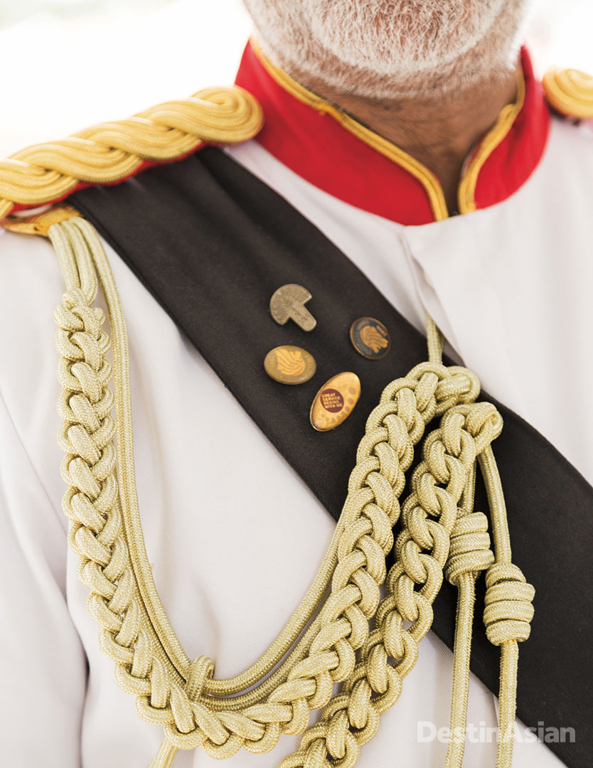 A detail of the Raffles' doorman's Savile Row-designed military uniform. 