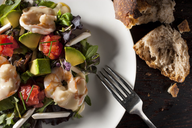 Dempsey's Steamed shrimp salad with avocado, mushroom, tomato with champagne vinaigrette.