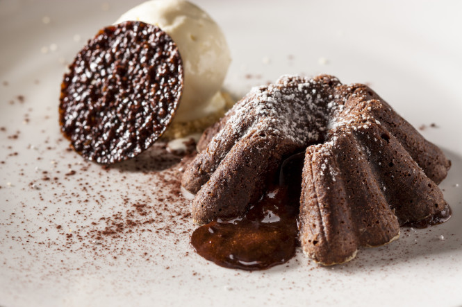 Warm Valrhona chocolate cake with cocoa bean brittle and vanilla bean ice cream. 