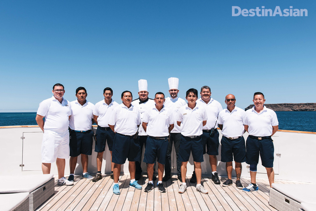All hands on deck—the captain and crew of the MV Origin, the newest vessel in the Ecoventura fleet.