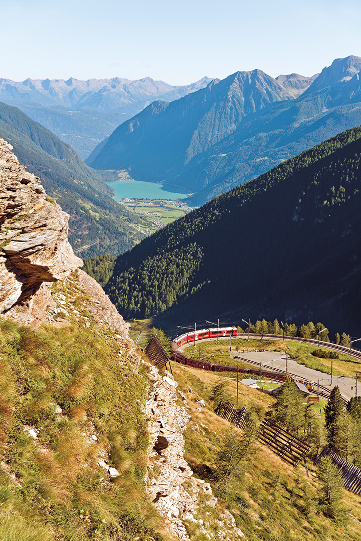 A train passing Alp Grüm, the last station on the line in the Romansh-speaking part of Switzerland before the railway descends to Val Poschiavo. 