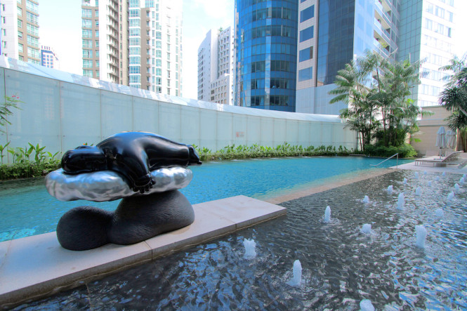 A sculpture of a Buddha blissfully sleeping on a cloud can be found right next to the pool.