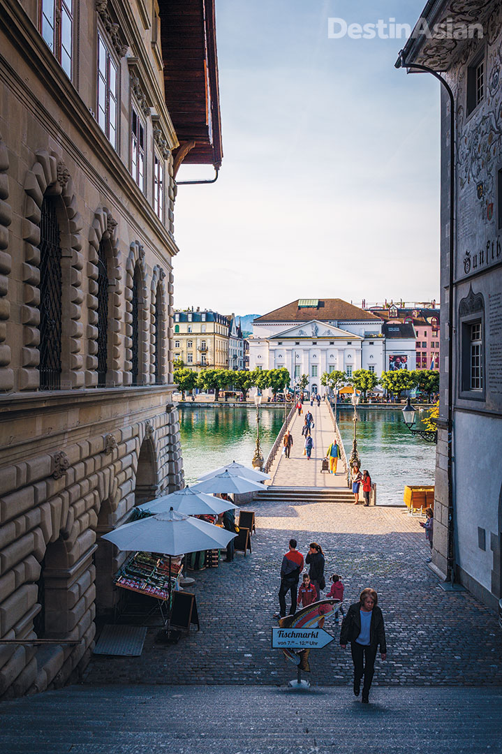 A cobbled passage beside Lucerne's old 17th-century town hall leads down to the Reuss River and the Neustadt ("new city") area beyond. All photos by Lola Akinmade Åkerström.