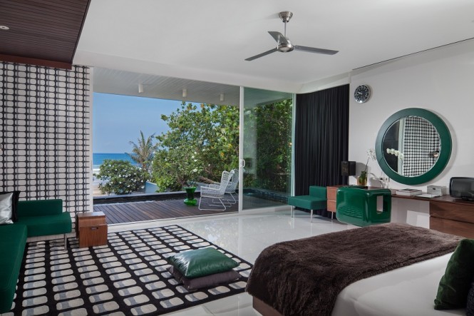 The master bedroom overlooks a roof terrace and the ocean.