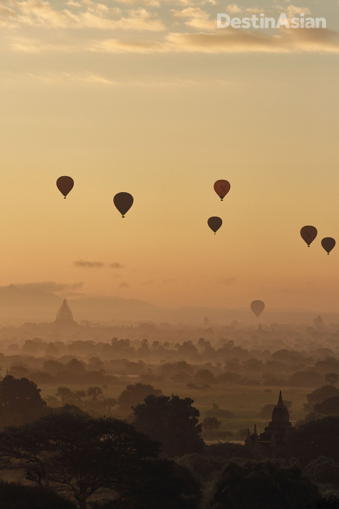 Hot-air balloons on a dawn flight over the temples and pagodas of Bagan.
