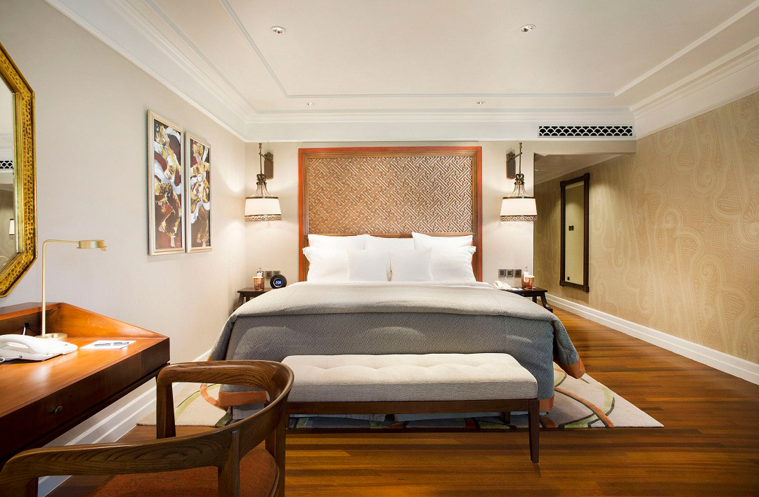 Rooms come with plenty of local flourishes, like the paintings of Legong dancers by the bed.