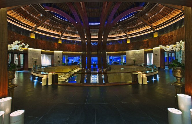 The banyan tree-inspired entry features a circle of life wood carving.