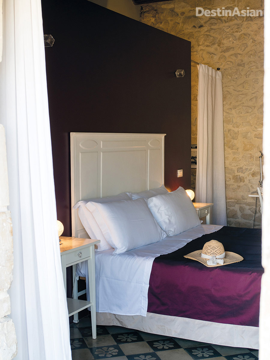 A bedroom at Casa Talía, where the attentive service and stylish decor are outmatched only by the views over Modica's Baroque townscape.