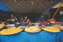Vendors selling halwa sweets and parathas outside the Muslim shrine of Hazratbal in Kashmir