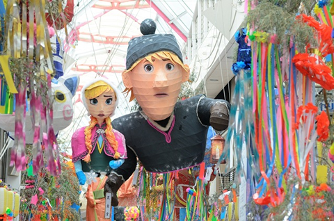Papier-mâché hangs from the ceilings in the form of characters from  Disney's Frozen. 