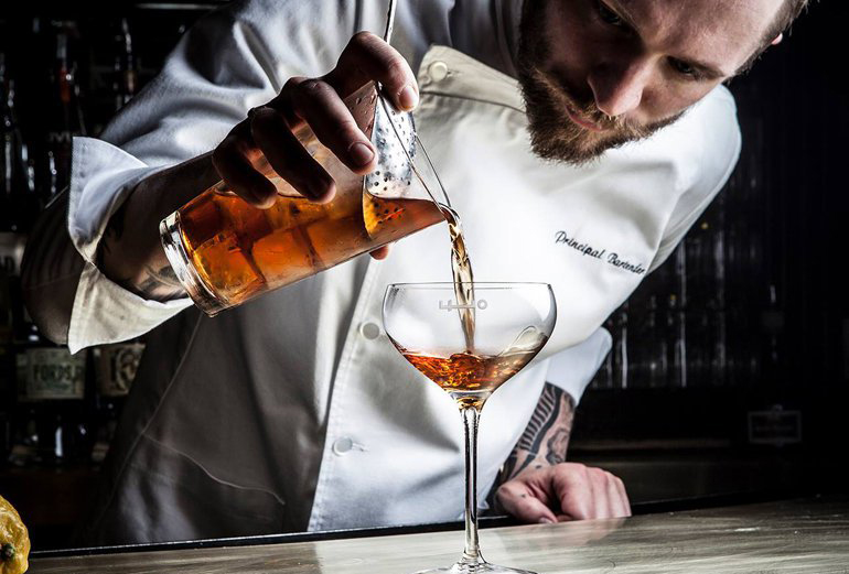 Employees Only's principal bartender Steve Schneider preparing a drink.