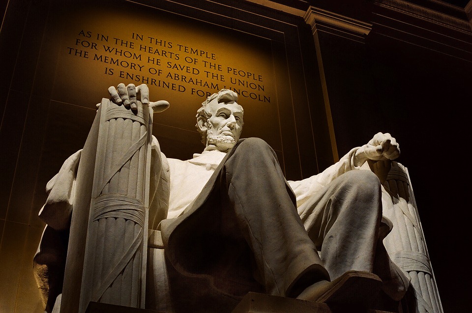 The inscription of gratitude glows behind the sculpture of Abraham Lincoln every night. 