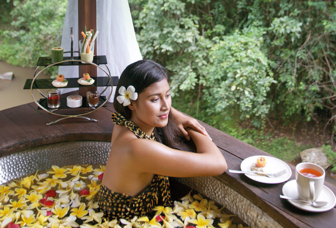 Enjoying a flower bath at Maya Ubud Resort & Spa.