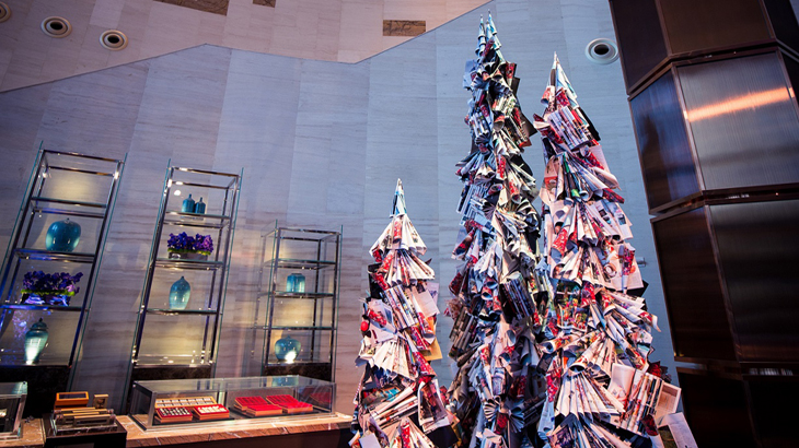 Christmas trees made out of outdated magazines.