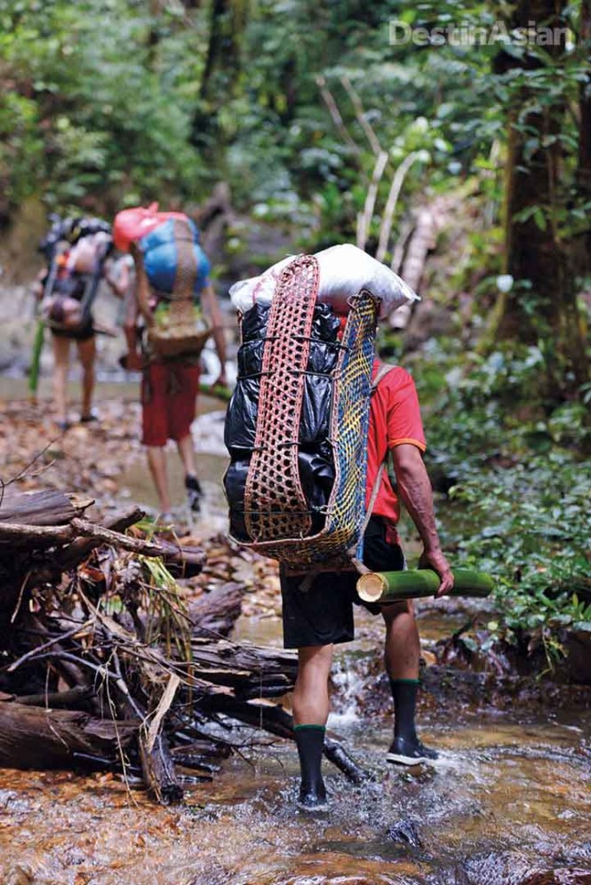 Iban porters heading into the jungle.