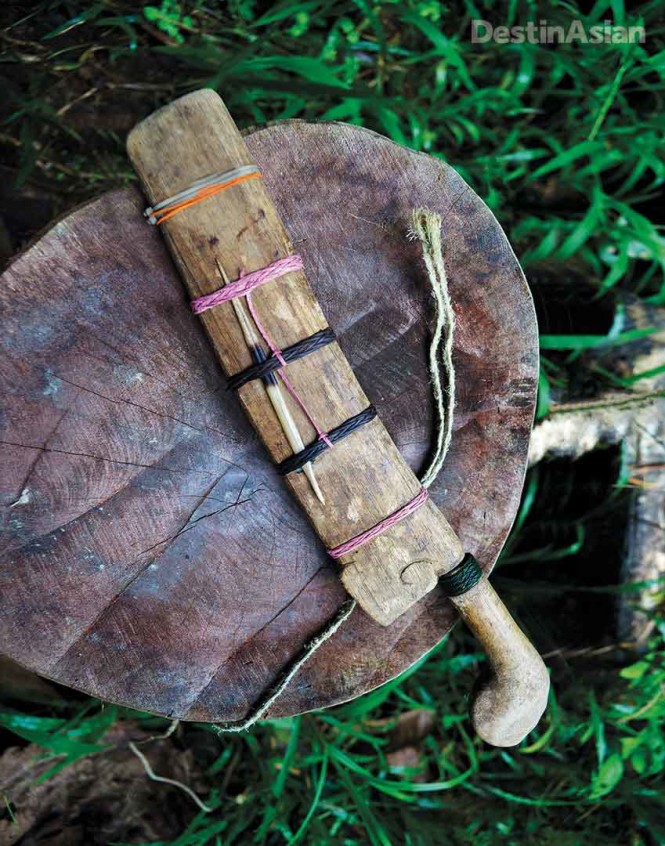 The wooden sheath of an Iban parang (machete), held together by natural twine and not-so-traditional cable ties.  