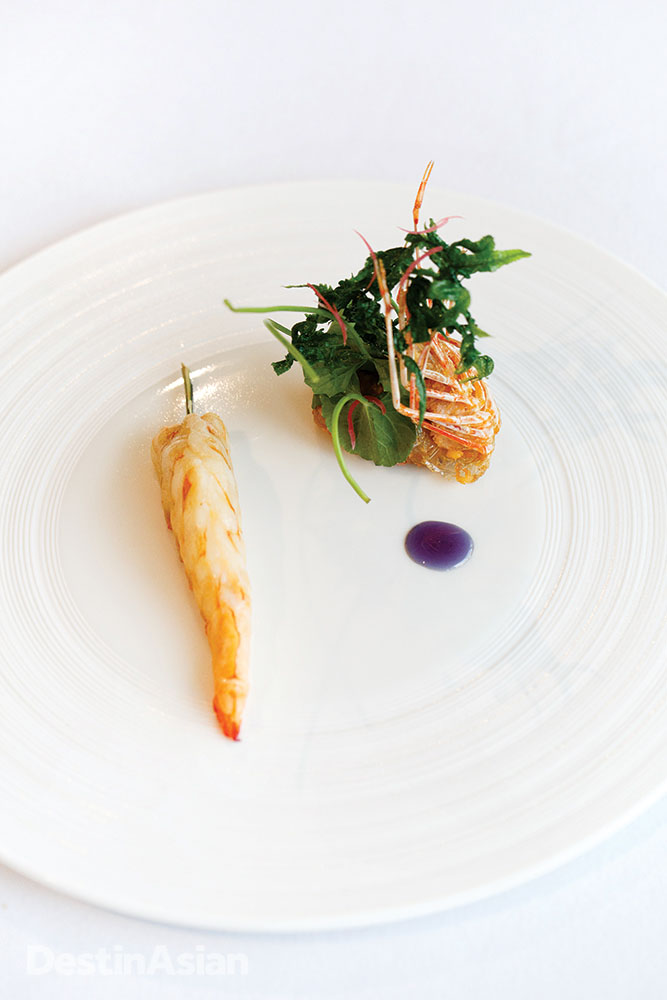 Red prawn and prawn tartare topped with fried prawn head and pegaga greens,