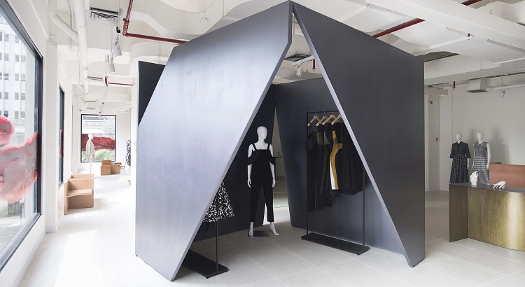 Peggy Hartanto's designs showcased inside a big black box. 