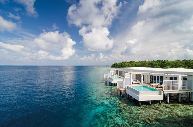 Reef-side overwater villas at Amilla Maldives.