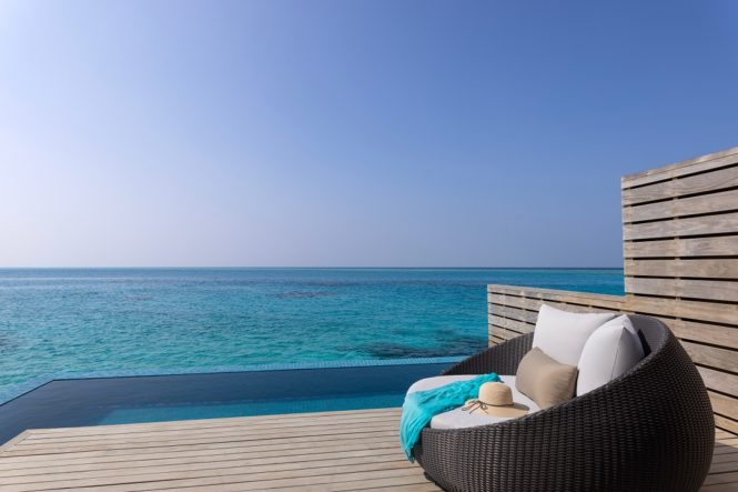 On the private deck of an Avani Over Water Pool Villa.