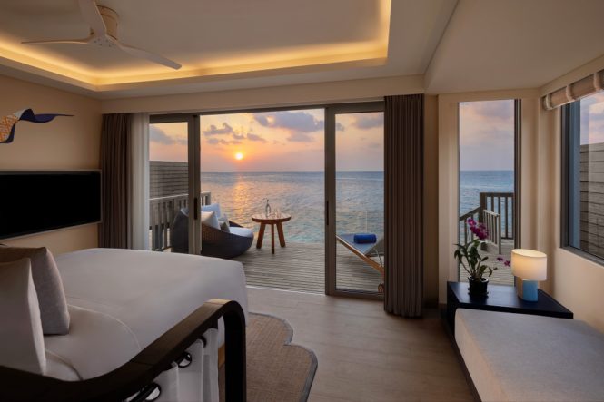 Sundown as seen from the bedroom of an Avani Sunset Over Water Villa.