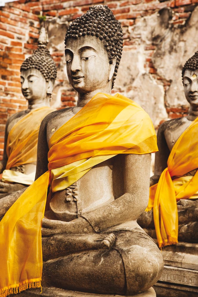 A rank of scarf-draped bodhisattva statues at Wat Phutthaisawan, on the south bank of the Chao Phraya River. 