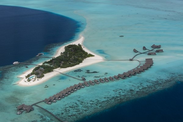 The resort is located in South Male’s coral atolls, a 35-minute speedboat transfer from the international airport.