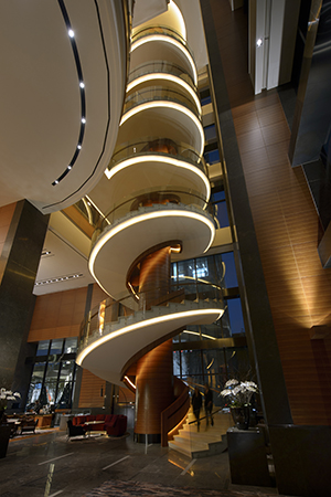 The stunning spiral staircase in the Conrad's lobby.