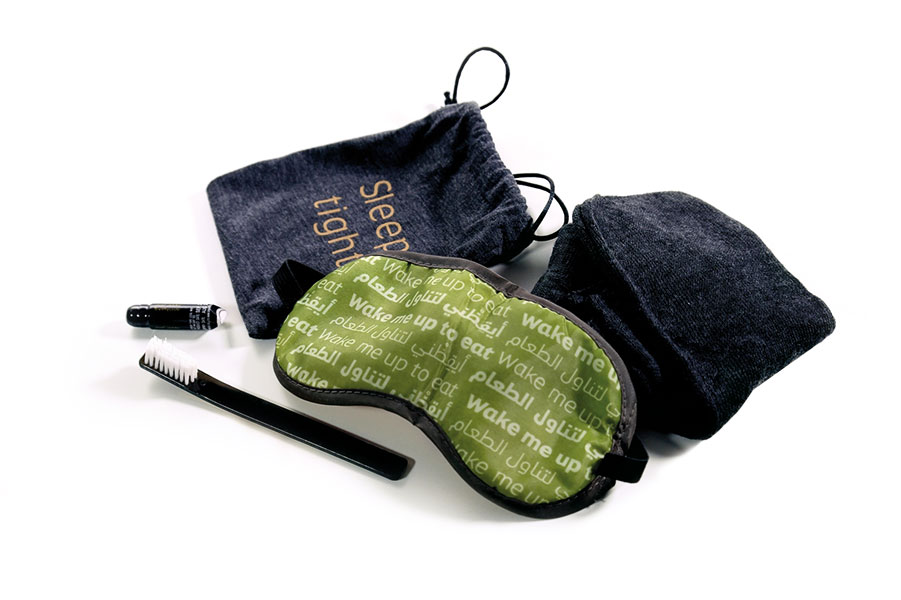 The cotton drawstring amenity kits in economy class include pillowcases and blankets too.