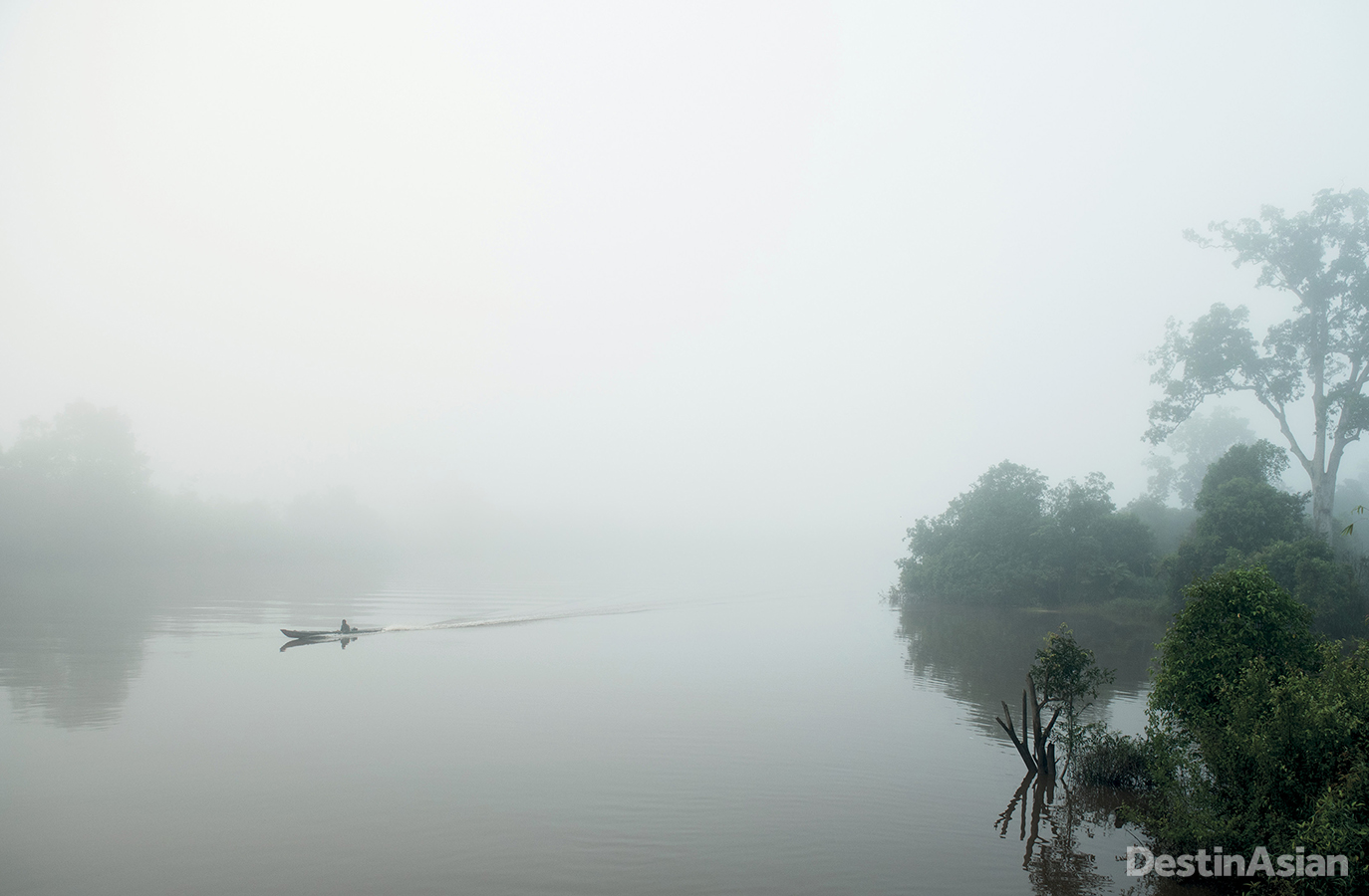 The early fog lifts slowly off the waters of the Rungan River in Central Kalimantan.