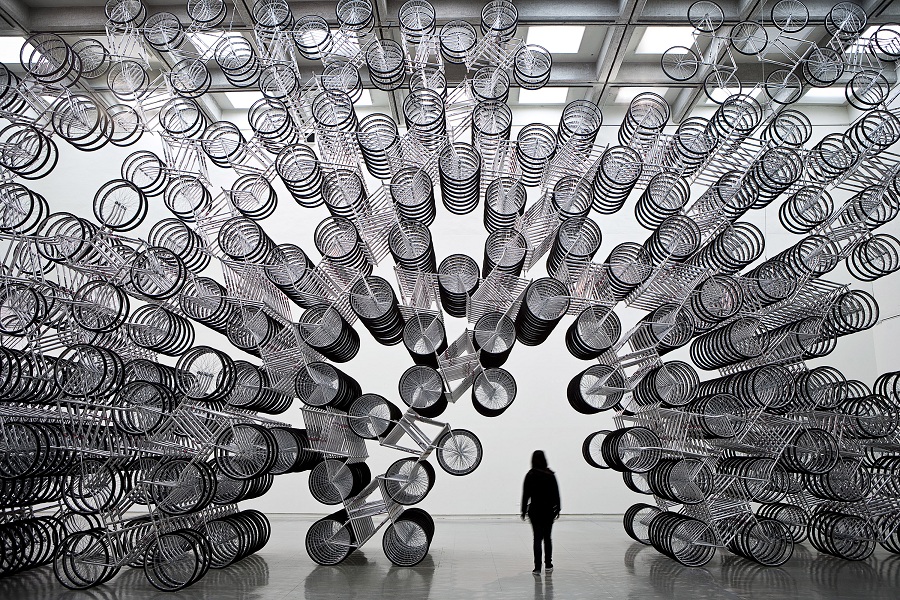 A new iteration of Ai's Forever Bicycles installation opens the exhibition with some 1,500 hanging bikes.