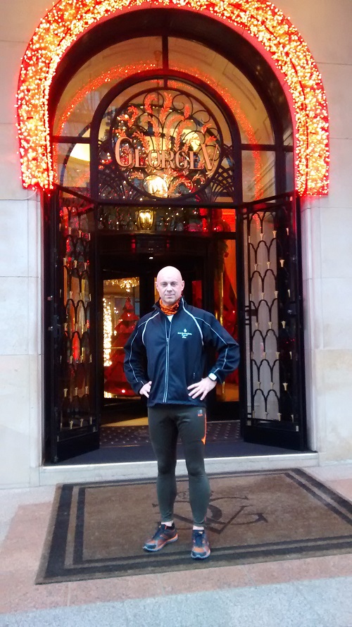 Pichon poses in front of the hotel at Christmastime. 