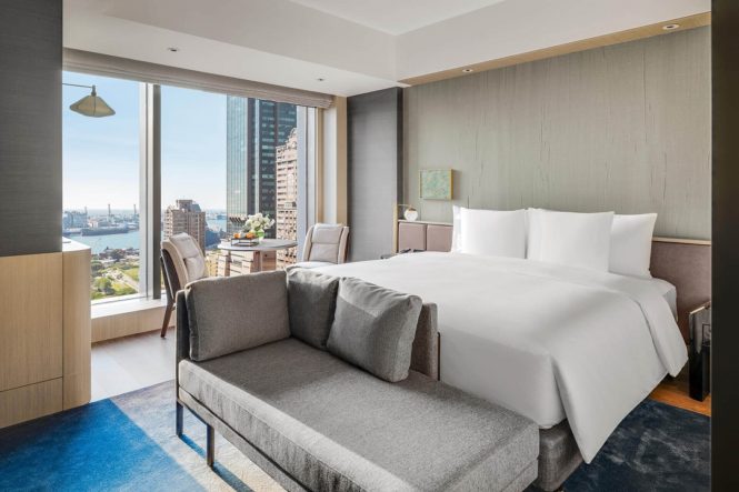 Inside a 36-square-meter King Classic Harbor View room on a higher floor.