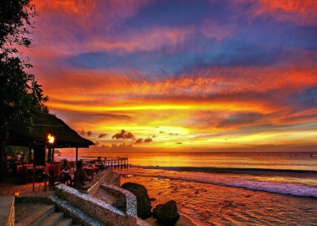 A watercolor sunset in Bali, home to one of the five Indonesian international airports that will offer visa-free travel. 