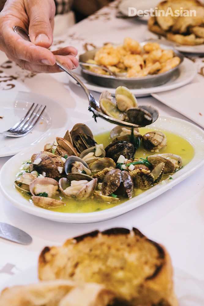 Digging in to a serving of clams Bulhao Pato at Cervejaria Ramiro, Lisbon's busiest, and arguably best, seafood restaurant.