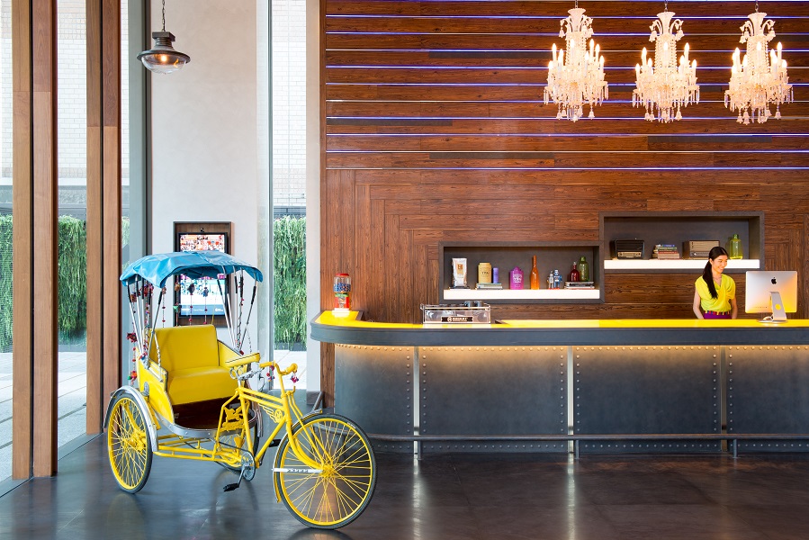 The hotel's lobby features Bangkok-inspired design details, such as the tuk-tuk pictured.