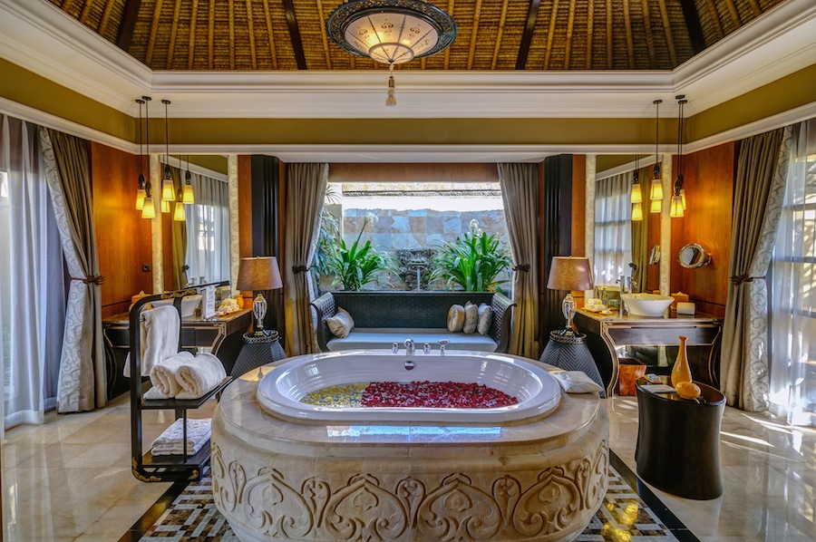 A hand-carved, Roman-style bath sits as the centerpiece in the marble bathrooms. 