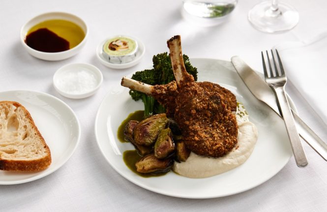 A first-class main course of crumbed Margra lamb cutlets with broccolini, brussels sprouts, and lemon myrtle celeriac puree.