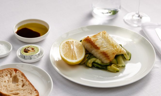 Pescatarians in Qantas first class can enjoy seared Glacier 51 toothfish with zucchini ribbon, lemon, and Cobram Estate Hojiblanca extra virgin olive oil.