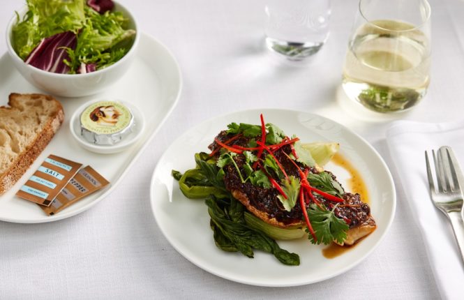 Seared snapper with black bean sauce, seasonal greens, and salted chili will be served in International business class.