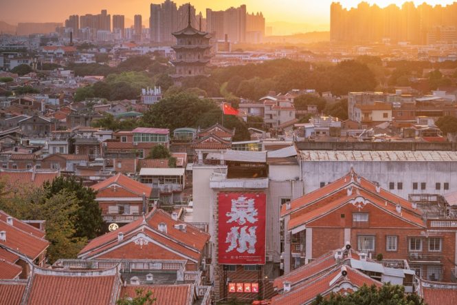 A sunset view of Quanzhou and the ancient twin pagodas of UNESCO-listed Kaiyuan Temple.
