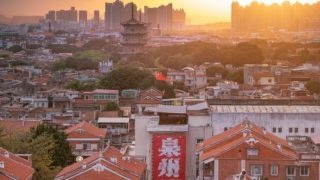 A sunset view of Quanzhou and the ancient twin pagodas of UNESCO-listed Kaiyuan Temple.
