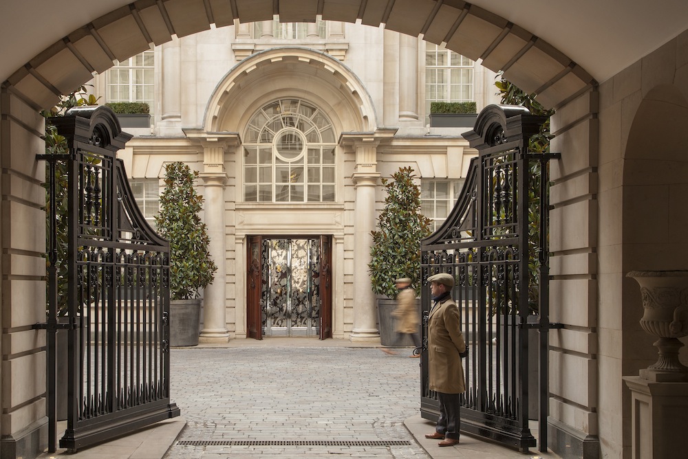 A wrought iron fence leads to the courtyard of the Rosewood.