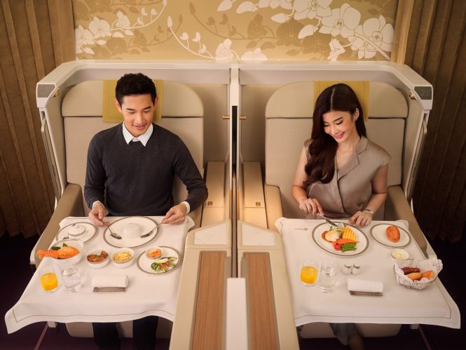 Royal First customers tucking into an in-flight meal.