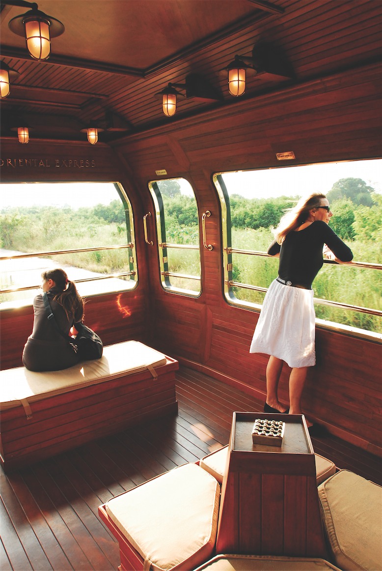 Taking in the views from E&O's teak-planked observation car.