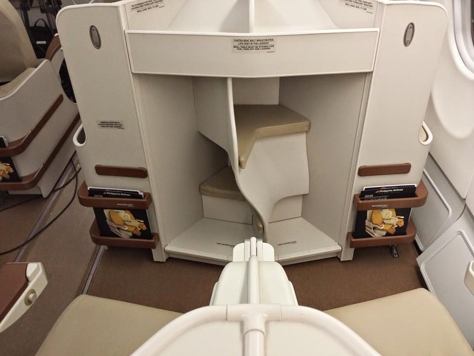 The cabin features layered seats for extra space and easier aisle access.