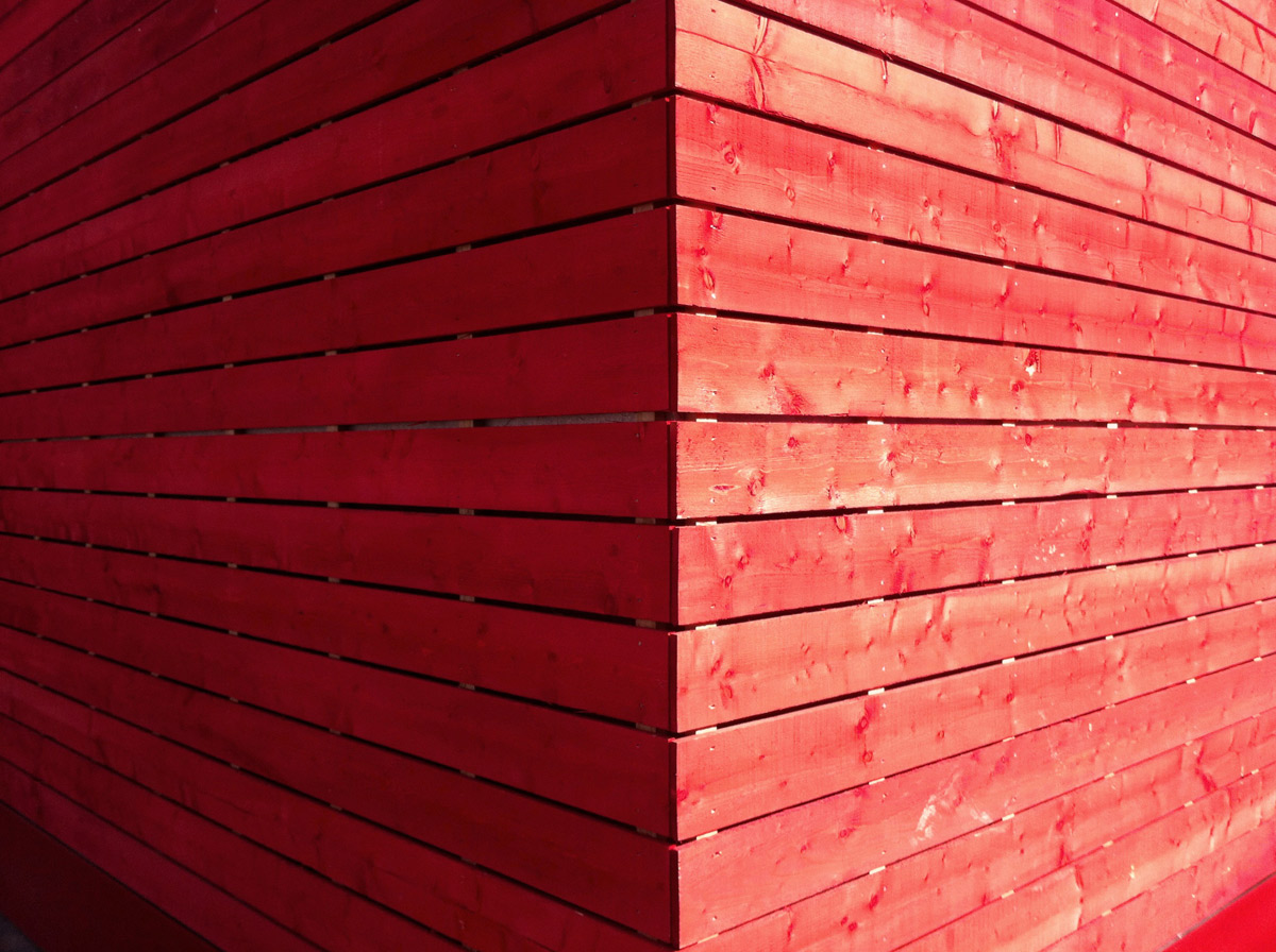 The architects decided to paint The Shed red shortly after deciding on using rough timber boards. 